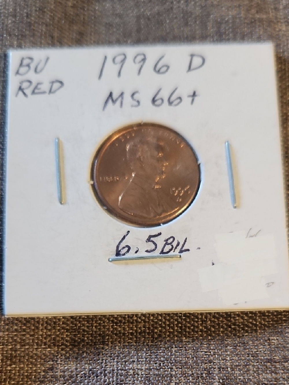 1996-D Lincoln Cent in White Cardboard Flip - Red/Bronze Tone